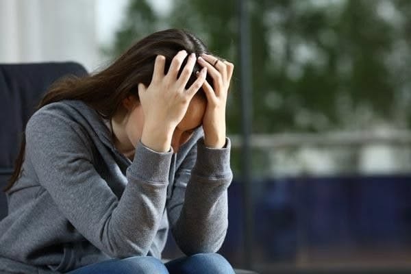 Person sitting quietly with a sense of calm, reflecting the space grief and loss therapy creates in Chicago