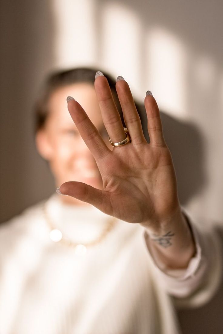 Woman holding up her hand in a stop gesture, representing pushing back against anxiety therapy myths in Chicago
