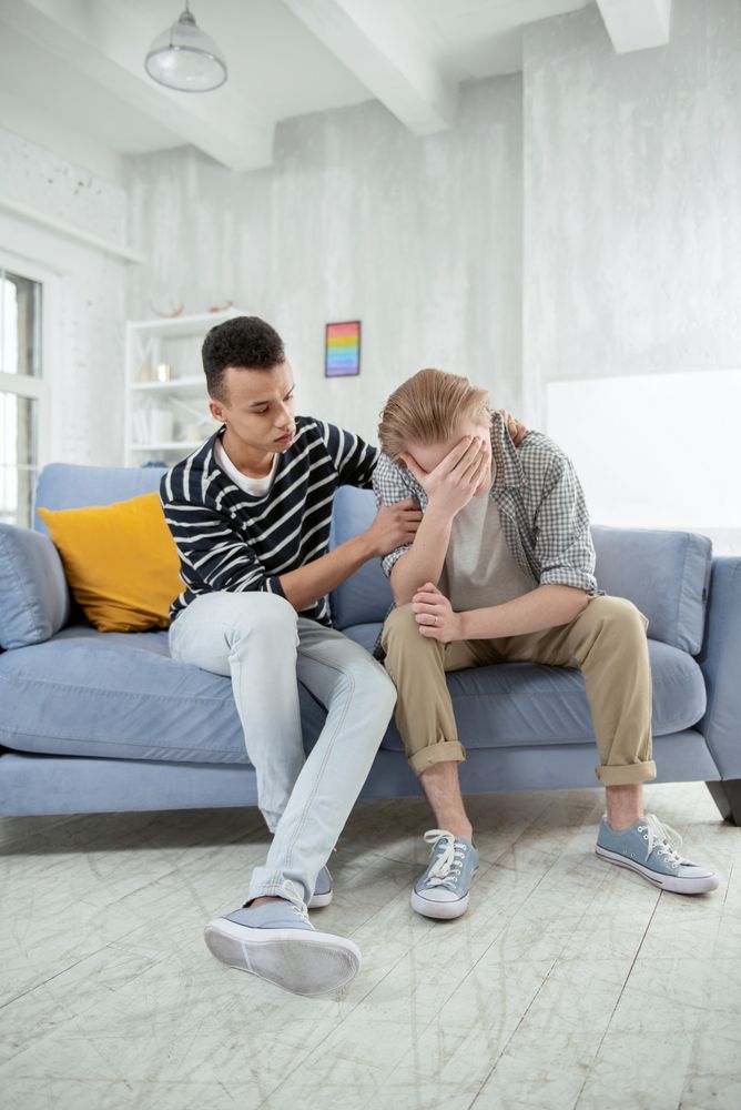 Diverse group offering each other support, reflecting the chosen family and community central to LGBTQIA+ affirming therapy in Chicago