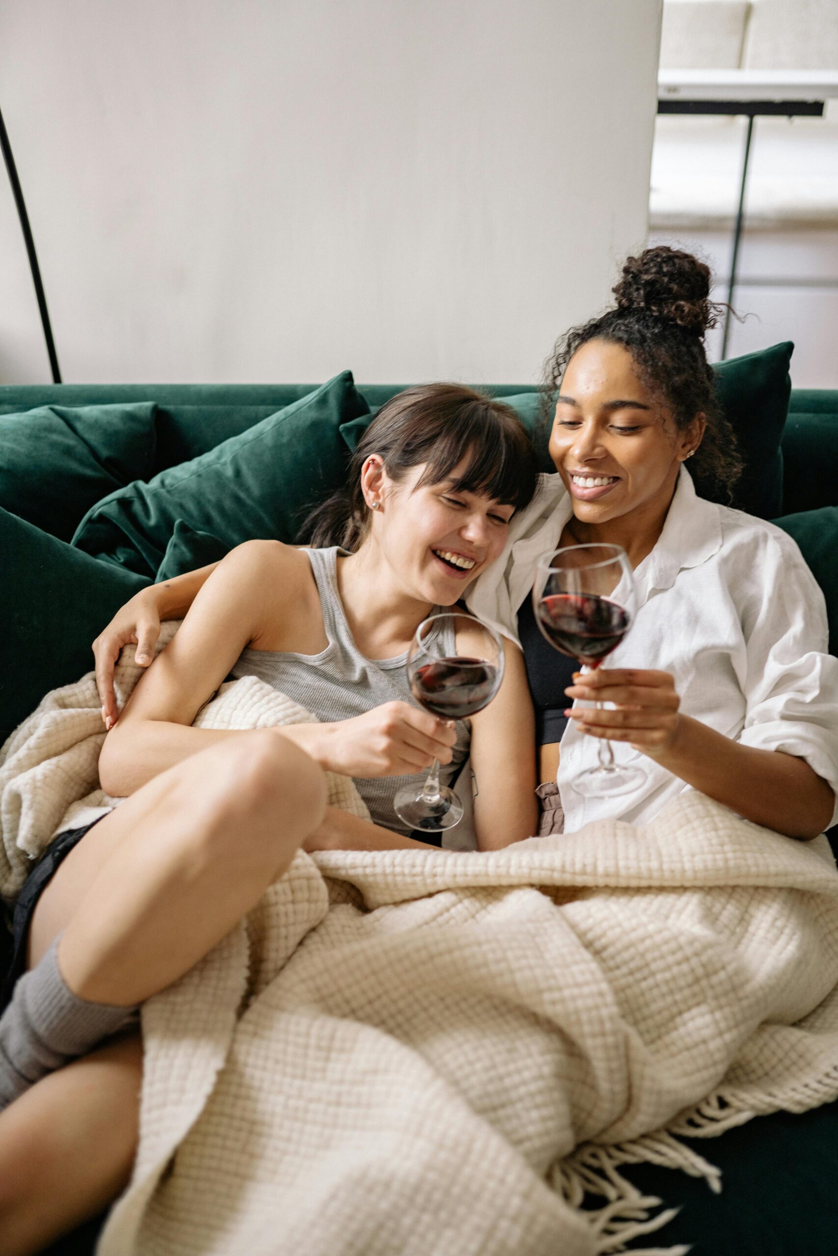 LGBTQIA+ couple in Chicago laughing together during a couples therapy session at Tides Mental Health